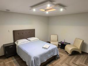 Postel nebo postele na pokoji v ubytování Hotel Douce Nuit