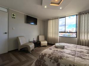 Postel nebo postele na pokoji v ubytování Hotel Douce Nuit