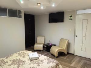 Postel nebo postele na pokoji v ubytování Hotel Douce Nuit