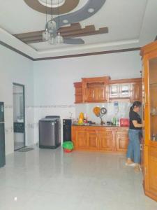 a person standing in a kitchen with at Cactus Homestay Ninh Thuan in Kinh Dinh