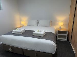 Postel nebo postele na pokoji v ubytování Brighton Hotel Motel + 29 fotografií
