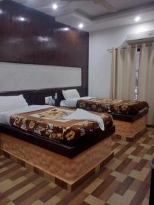 Postel nebo postele na pokoji v ubytování Siddhartha Kuti Resort + 23 fotografií