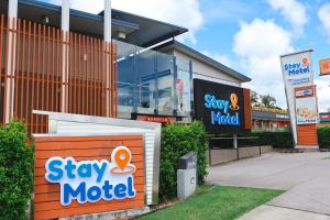 a store front with a sign for astay motel at Stay Motel - Formerly Room Motels Gympie in Gympie