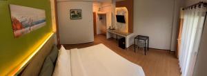 TV a/nebo společenská místnost v ubytování BanPunmanus Hotel + 18 fotografií