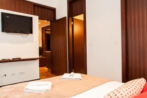 Postel nebo postele na pokoji v ubytování Centroom Apartments Zagreb