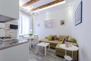 a living room with a couch and a table at Dream Holiday Apartment in Dubrovnik