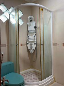 a shower in a bathroom with a sink and a toilet at Vila Sentul Private pool 6bedroom, 5bathroom, Privatepool tennis meja, Billiard, 0813delapannolsatuenam4151 in Gadok 1 +23 photos