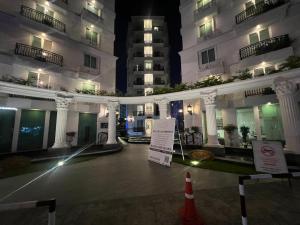 a view of a building at night at City Garden Olympus Condo By Vacation Vibes in Pattaya South