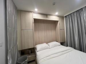 Ένα ή περισσότερα κρεβάτια σε δωμάτιο στο City Garden Olympus- 606