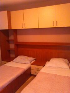 Posteľ alebo postele v izbe v ubytovaní Apartments Villa Leona