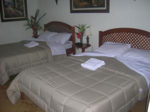 Rúm í herbergi á Hotel Esperanza