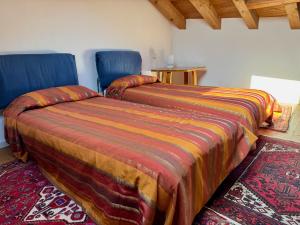 A bed or beds in a room at Motta di Livenza Deluxe - Deluxe Apartments Italia