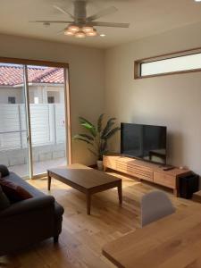 TV a/nebo společenská místnost v ubytování Kamamanmi + 2 fotografie