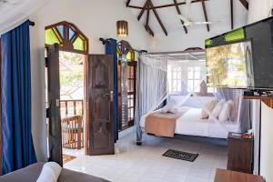 Postel nebo postele na pokoji v ubytování Serenity Beach Cabanas