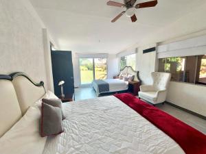 Postel nebo postele na pokoji v ubytování Casa De La O Yautepec