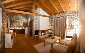 a living room with a couch and a table at Levanta Guesthouse in Synikia Mesi Trikalon