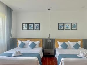 Postel nebo postele na pokoji v ubytování Kep Sea View Hotel & Sky Bar