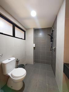 a bathroom with a toilet and a shower at No 8 Homestay in Pangkor +9 photos
