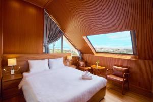 Letto o letti in una camera di Lotus Hotel Đà Lạt