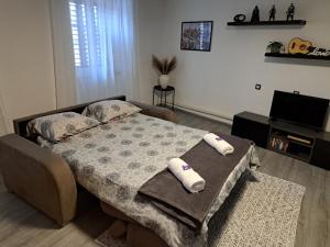 Postel nebo postele na pokoji v ubytování Apartman Darija