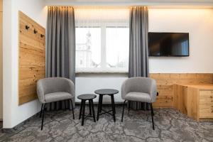 Televiisor ja/või meelelahutuskeskus majutusasutuses Hotel Forellenhof