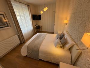 Postel nebo postele na pokoji v ubytování OXXOTEL & Spa