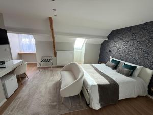 Postel nebo postele na pokoji v ubytování OXXOTEL & Spa