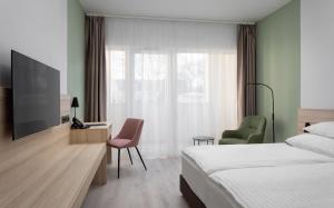 TV a/nebo společenská místnost v ubytování Hunguest Hotel Flóra