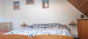 Postel nebo postele na pokoji v ubytování Gîte et chambres d'hôtes Les Framboises