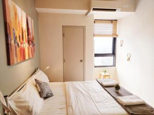 a bedroom with a bed and a window at F1-33-13 Sweet Home5,1BRTamarindWiFiNetflixFreeParking in Cyberjaya +35 photos