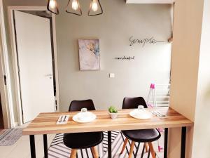 a dining room with a wooden table and chairs at F1-33-13 Sweet Home5,1BRTamarindWiFiNetflixFreeParking in Cyberjaya