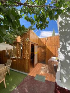 an outside view of a wooden house with a patio at Cozinn A104 in Leh +18 photos