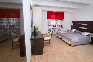 Postel nebo postele na pokoji v ubytování Al Bastione Relais Suite & Rooms