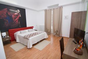 Postel nebo postele na pokoji v ubytování Al Bastione Relais Suite & Rooms