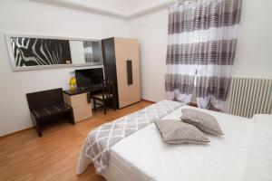 Postel nebo postele na pokoji v ubytování Al Bastione Relais Suite & Rooms