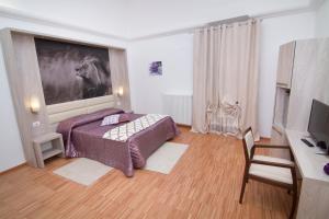 Postel nebo postele na pokoji v ubytování Al Bastione Relais Suite & Rooms