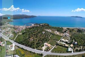 an aerial view of a small island with the ocean at Koutrakis Rooms in Finikounta