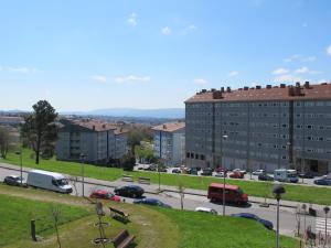 a view of a city with a parking lot at Apartamentos Turísticos Cancelas by Bossh Hotels in Santiago de Compostela