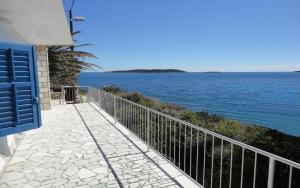 a view of the ocean from a balcony of a house at Holiday House Vis Pavic in Vis