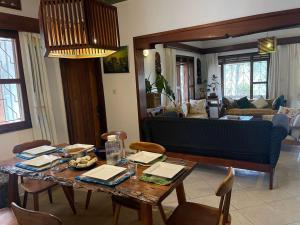 a living room with a table and a couch at Guest room 1, A home away from home in Kampala