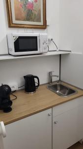 Kuchyň nebo kuchyňský kout v ubytování Mxp Room Busto