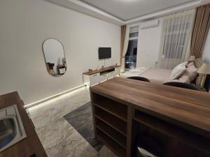 a hotel room with a bed and a mirror at Slavija Residence Apartments in Belgrade