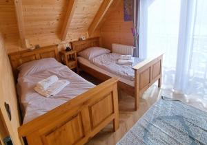 Postel nebo postele na pokoji v ubytování Willa Marmolada