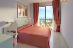Postel nebo postele na pokoji v ubytování Hotel Eden Gigli + 37 fotografií