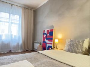 Posteľ alebo postele v izbe v ubytovaní Art apartment on Rynok Square