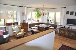 Televízia a/alebo spoločenská miestnosť v ubytovaní Apartment Ischl Home