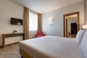 Postel nebo postele na pokoji v ubytování Klima Hotel Milano Fiere