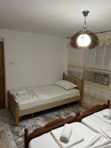 Postel nebo postele na pokoji v ubytování Guest House LION