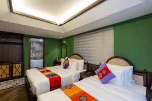 Postel nebo postele na pokoji v ubytování Fansipan View Hotel