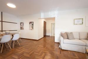 a living room with a couch and a table at Seaside Elegance Brand New 2BD Luxury Stay in Athens
